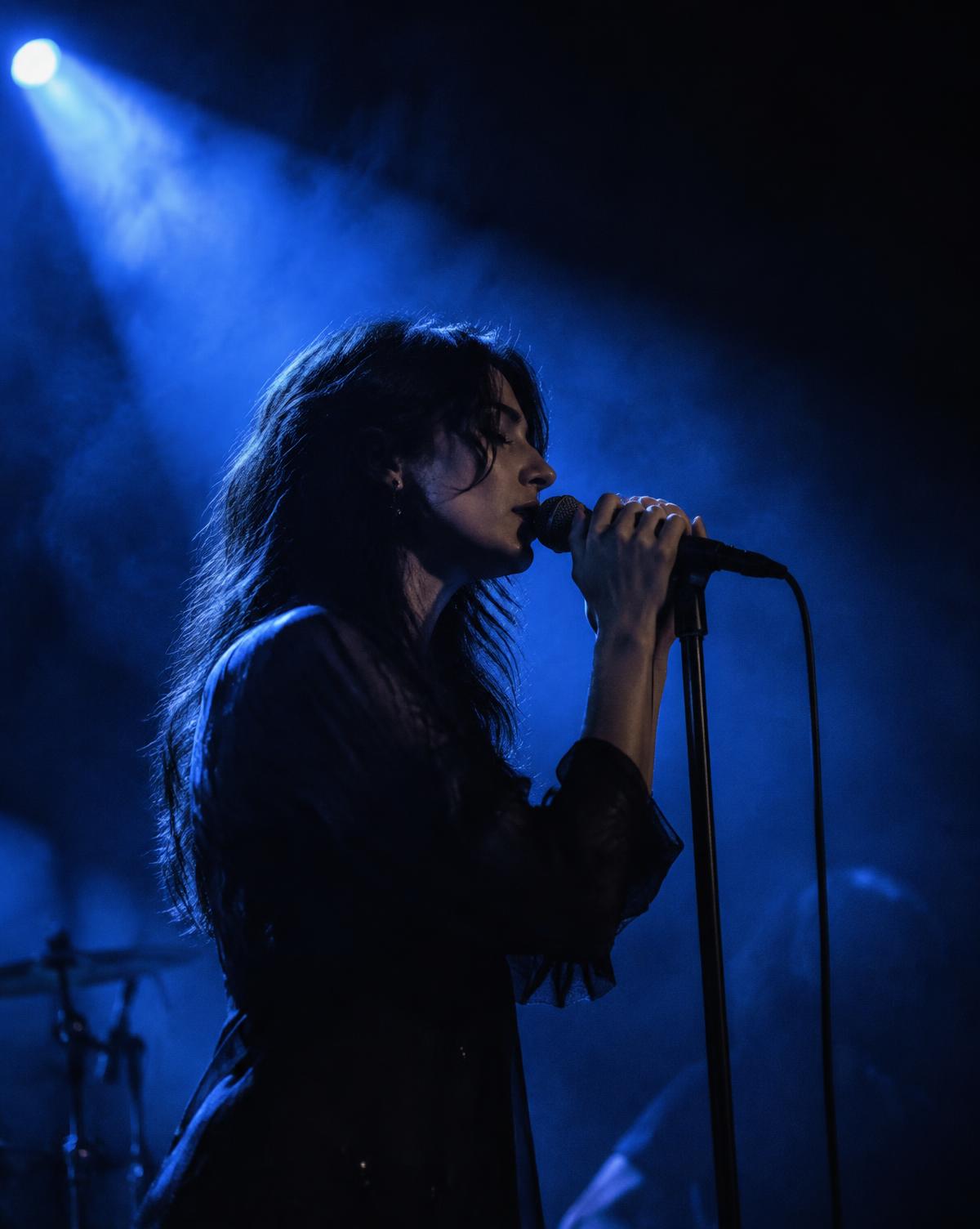 Vocalist in blue stage light